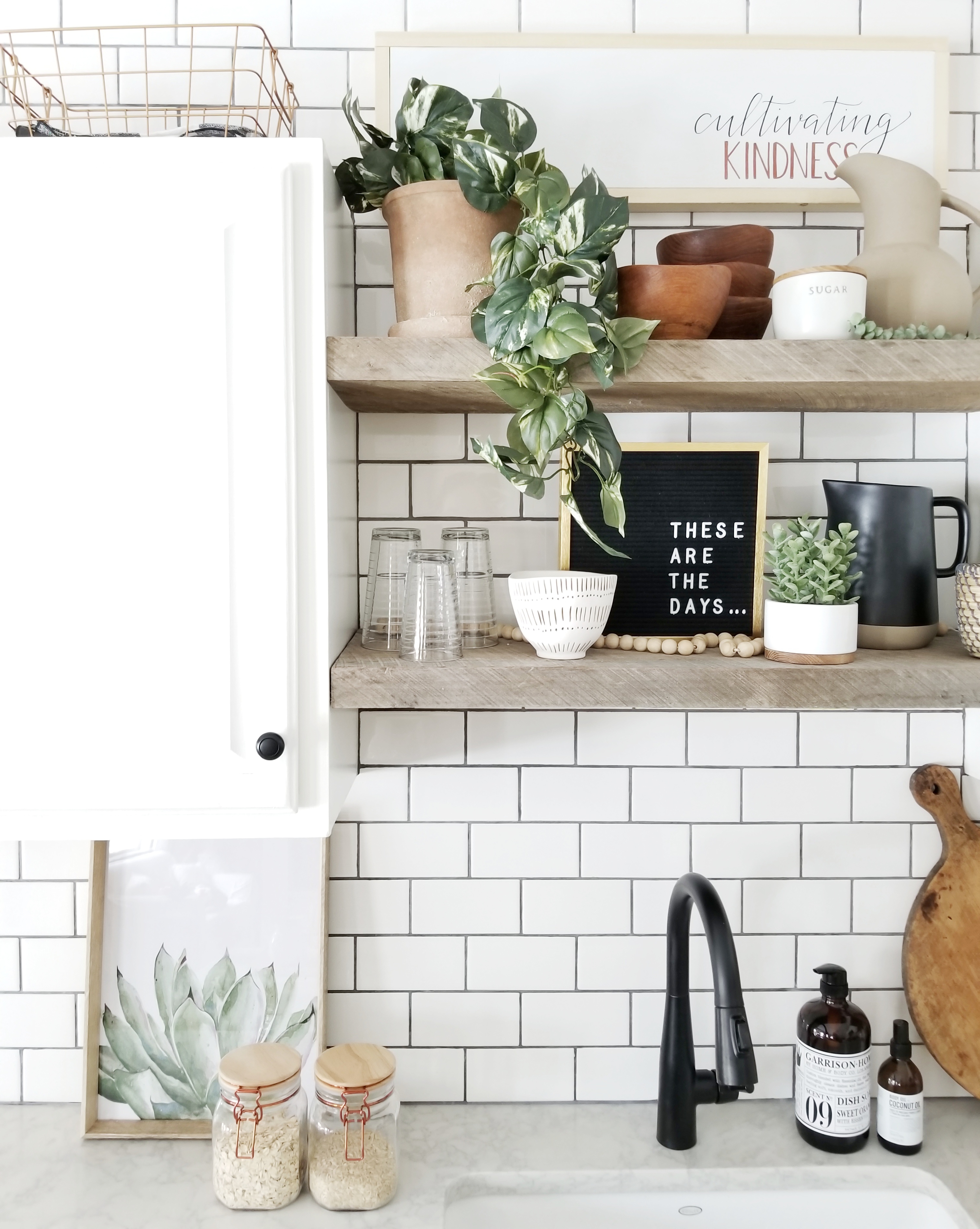Simple spring style on open shelves in kitchen. Easy tips for spring home decor.