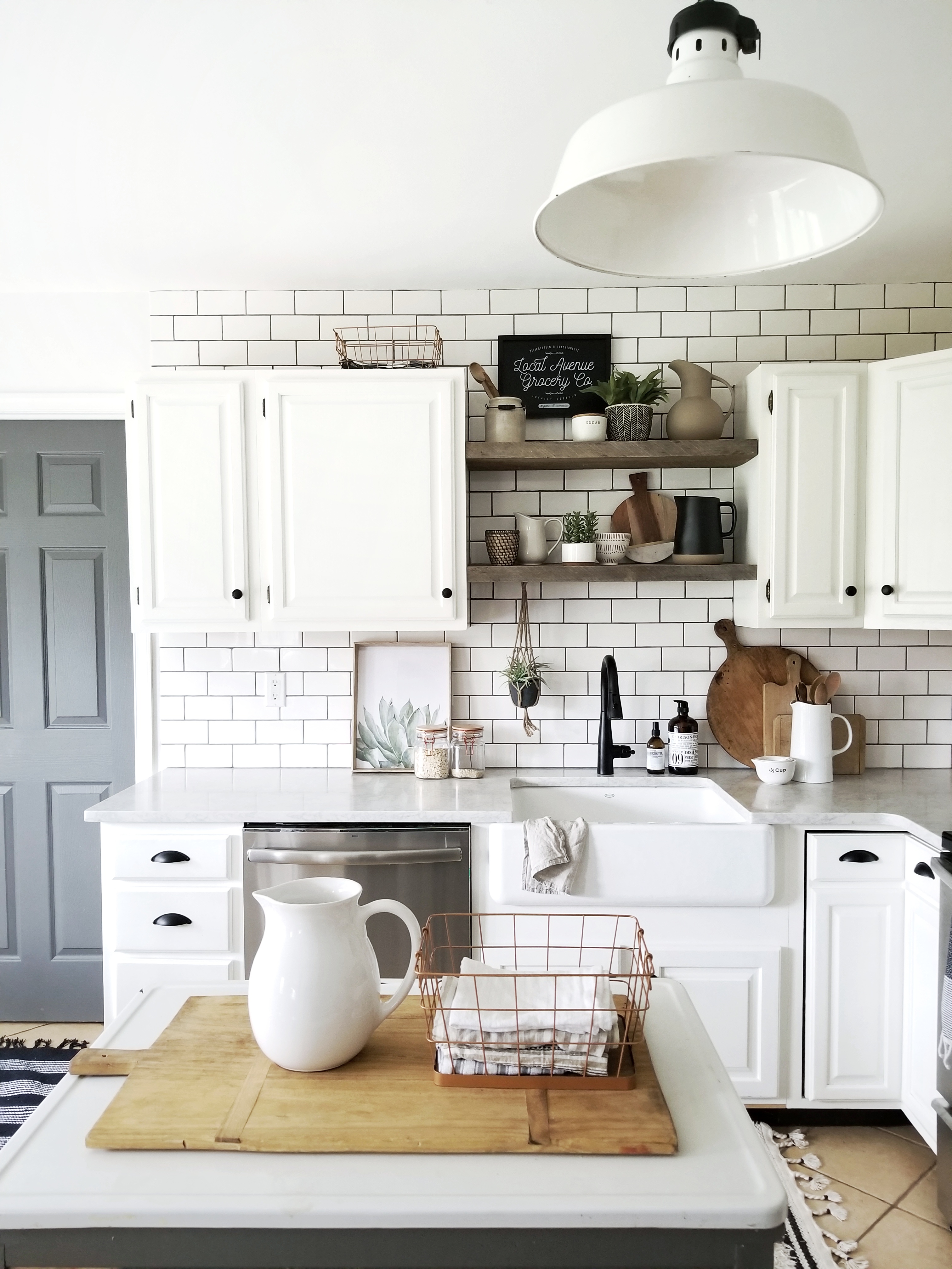Modern farmhouse kitchen renovation with subway tile and open shelves